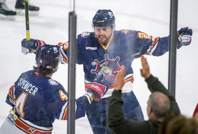 Peoria's Meirs Moore (28) and Chase Spencer celebrate Moore's goal against the Huntsville Havoc in the first period of the deciding game of the SPHL President's Cup finals Sunday, April 28, 2024 at the Peoria Civic Center.
