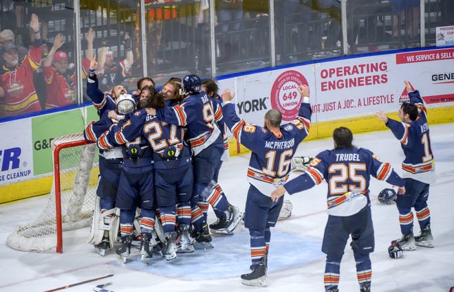 The Peoria Rivermen spill onto the ice in celebration of their 5-1 victory over the Huntsville Havoc in the deciding game of the SPHL President's Cup finals Sunday, April 28, 2024 at the Peoria Civic Center.