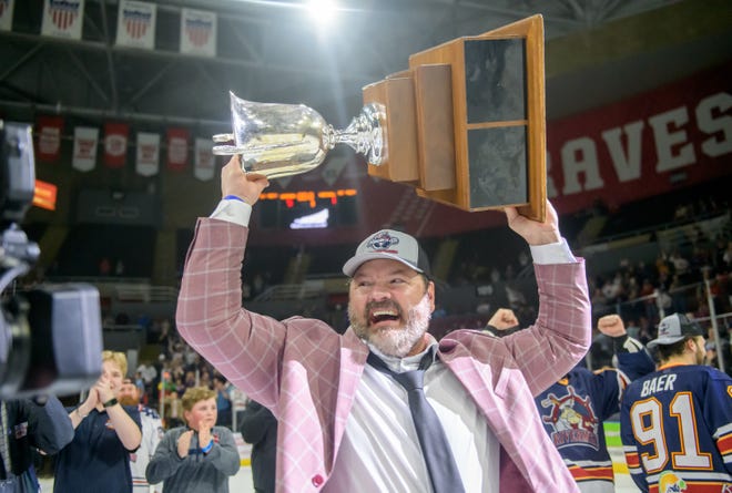 Peoria Rivermen head coach Jean-Guy Trudel hoists the President's Cup after the team defeated the Huntsville Havoc 5-1 in the deciding game of the SPHL President's Cup finals Sunday, April 28, 2024 at the Peoria Civic Center.