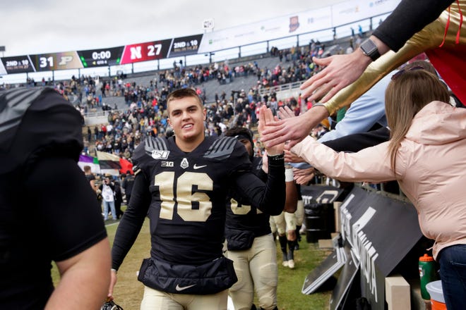Purdue quarterback Aidan O'Connell (16) celebrates with fans after defeating Nebraska, 31-27, Saturday, Nov. 2, 2019 at Ross-Ade Stadium in West Lafayette.