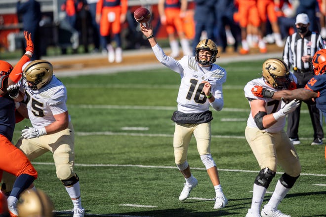 Oct 31, 2020; Champaign, Illinois, USA; Purdue Boilermakers quarterback Aidan O'Connell (16) passes against the Illinois Fighting Illini during the first half at Memorial Stadium. Mandatory Credit: Patrick Gorski-USA TODAY Sports