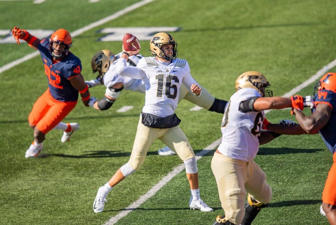 Oct 31, 2020; Champaign, Illinois, USA; Purdue Boilermakers quarterback Aidan O'Connell (16) passes against the Illinois Fighting Illini during the first half at Memorial Stadium. Mandatory Credit: Patrick Gorski-USA TODAY Sports