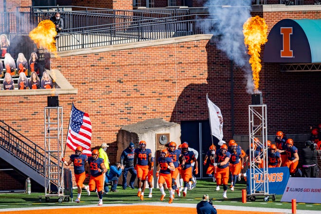 Oct 31, 2020; Champaign, Illinois, USA; The Illinois Fighting Illini enter the field prior to the first half against the Purdue Boilermakers at Memorial Stadium. Mandatory Credit: Patrick Gorski-USA TODAY Sports