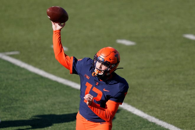 Illinois quarterback Matt Robinson passes during the first half of an NCAA college football game against Purdue Saturday, Oct. 31, 2020, in Champaign, Ill. (AP Photo/Charles Rex Arbogast)