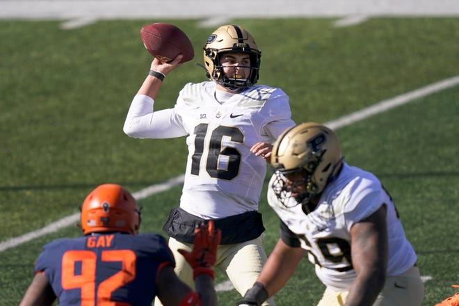 Purdue quarterback Aidan O'Connell (16) passes during the first half of an NCAA college football game against Illinois Saturday, Oct. 31, 2020, in Champaign, Ill. (AP Photo/Charles Rex Arbogast)