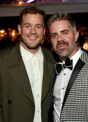 TV personality Colton Underwood, left, and Jordan C. Brown attend the Baby2Baby 10-Year Gala presented by Paul Mitchell on Nov. 13, 2021.